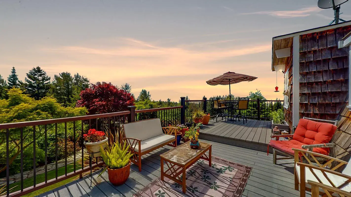 Redwood deck overlooking the forested hills of Humboldt County at sunset