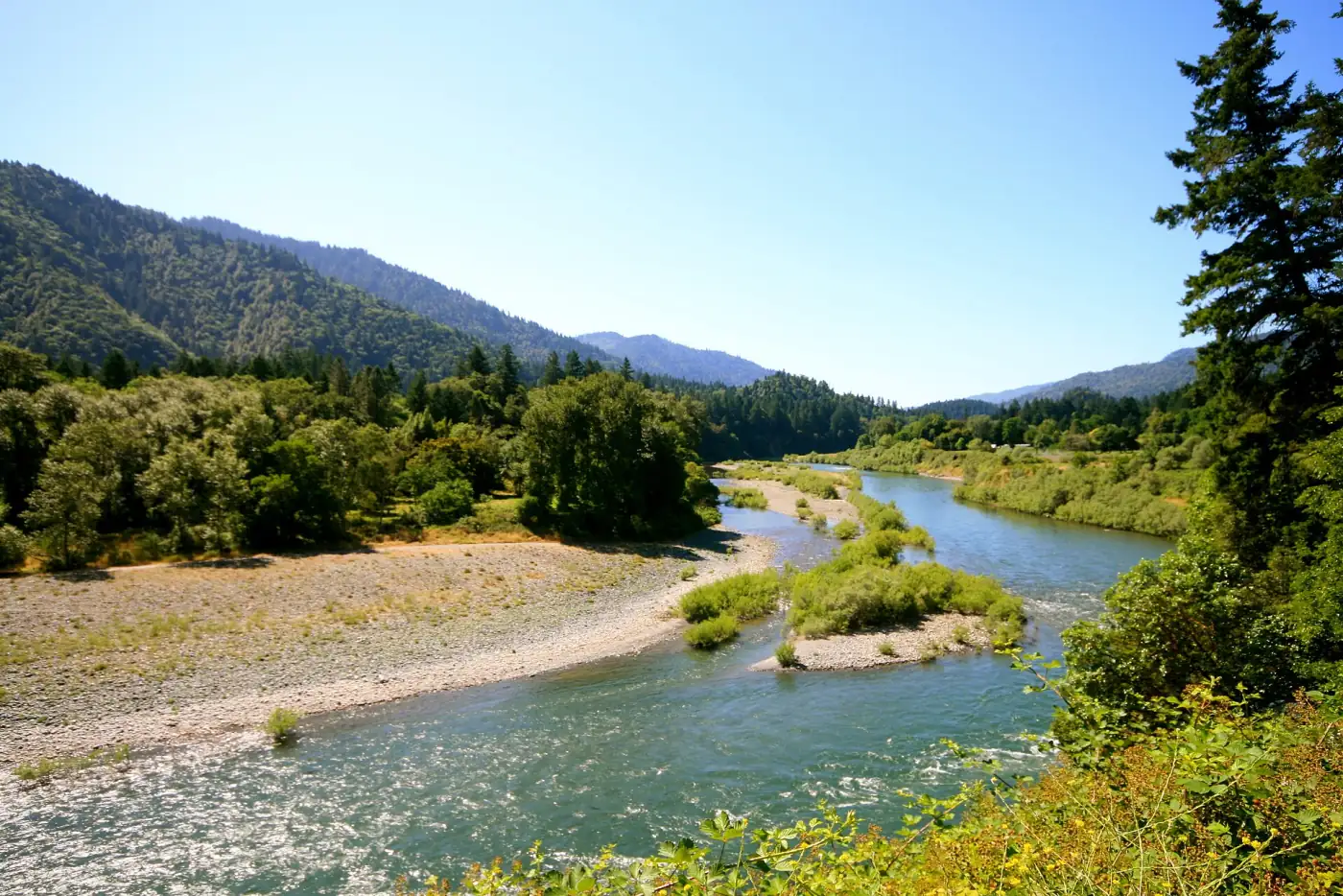 The broad Trinity River and its gravel bars in the Hoopa Valley, mountains rising on both sides