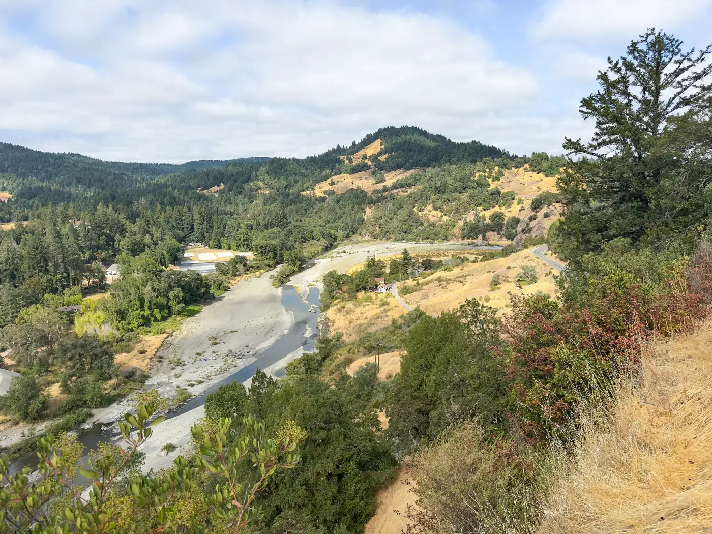 The South Fork Eel River winding through a forested valley of southern Humboldt, seen from a bluff